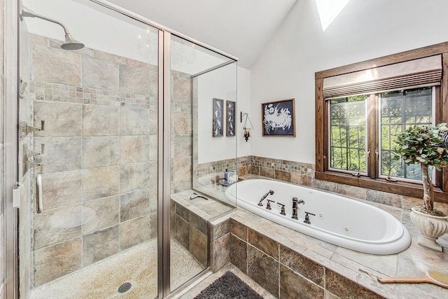 bathroom featuring independent shower and bath and lofted ceiling