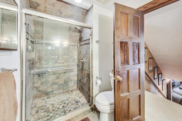 bathroom featuring toilet, walk in shower, and tile patterned floors