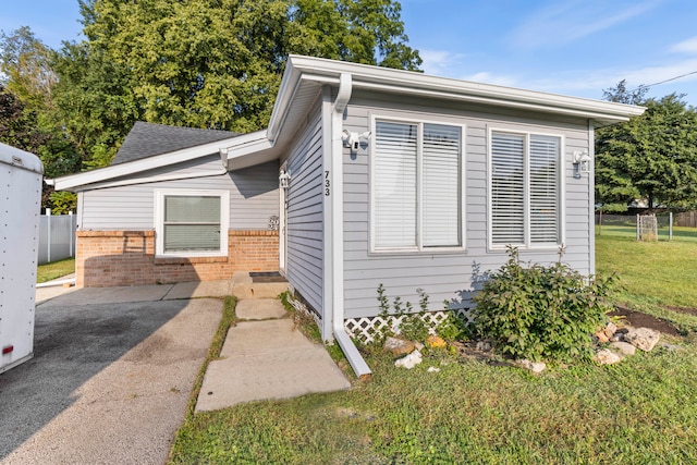 view of front of property with a front lawn and a patio