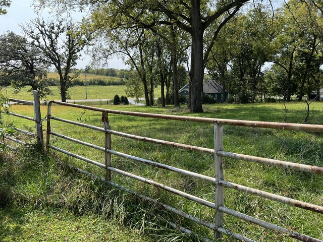 view of yard with a rural view