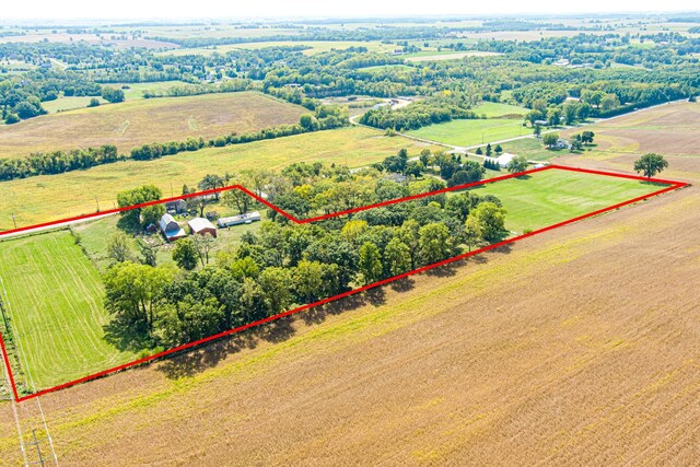 birds eye view of property with a rural view