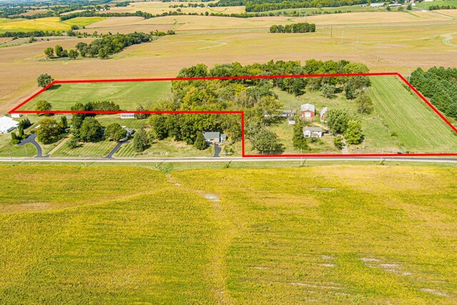 birds eye view of property featuring a rural view