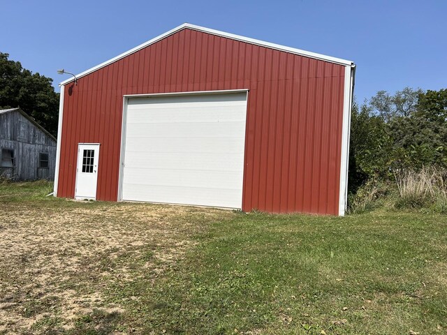 garage with a yard