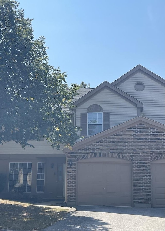 traditional-style home with brick siding