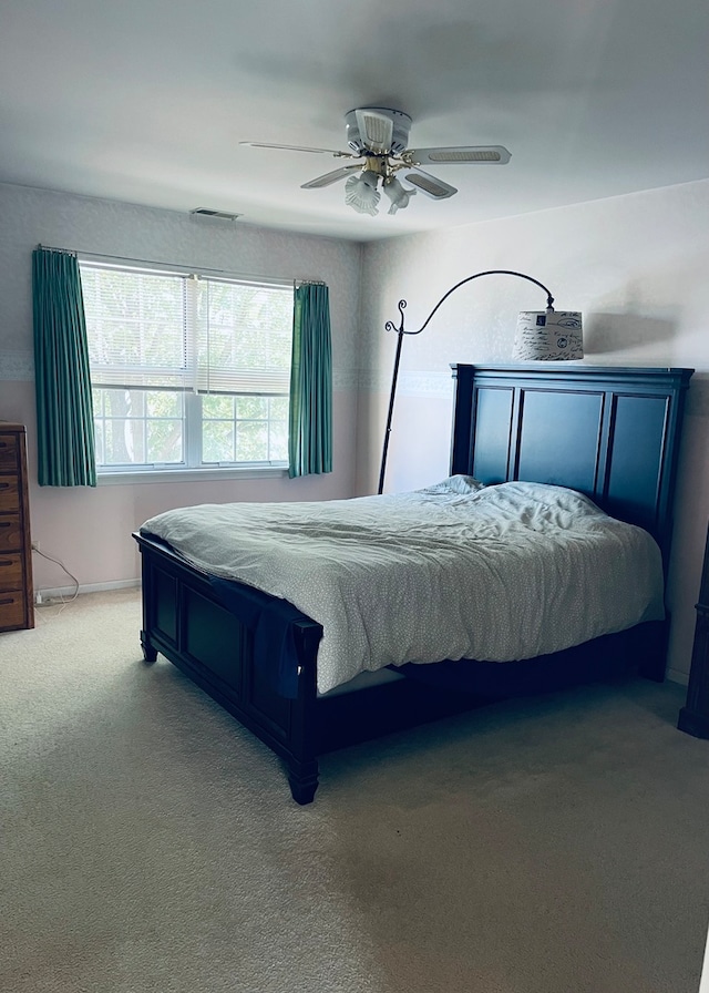 carpeted bedroom featuring ceiling fan