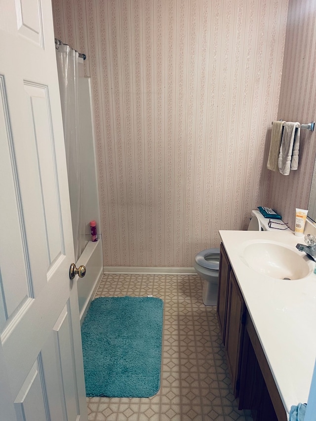 full bathroom featuring vanity, toilet, and shower / bathtub combination with curtain