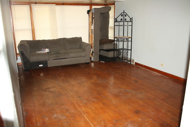 unfurnished living room featuring dark wood-type flooring