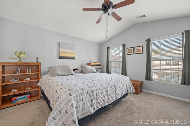 bedroom featuring light colored carpet, a ceiling fan, baseboards, vaulted ceiling, and visible vents