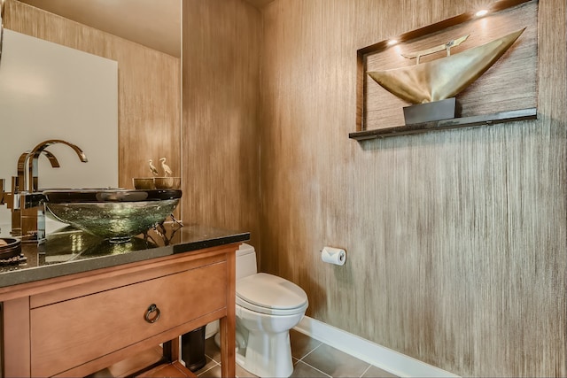 bathroom with tile patterned floors, toilet, and vanity