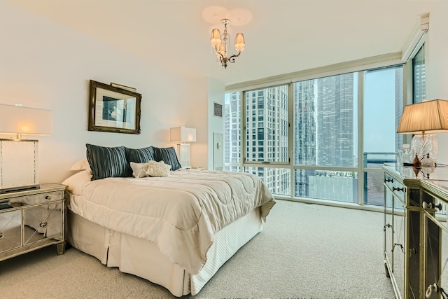 carpeted bedroom with floor to ceiling windows and an inviting chandelier