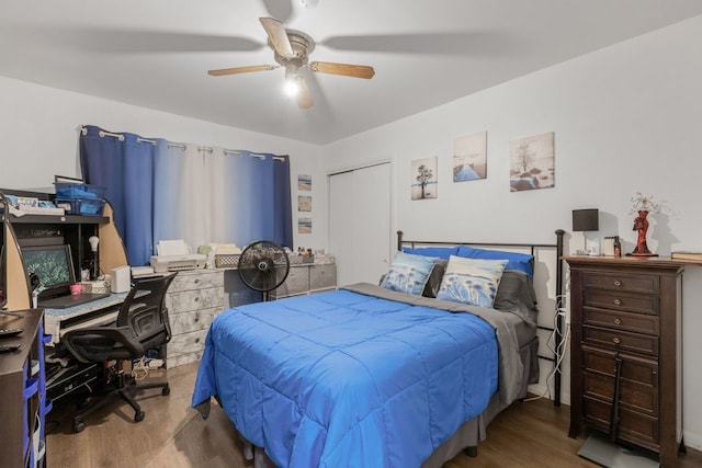 bedroom with ceiling fan, a closet, and hardwood / wood-style floors