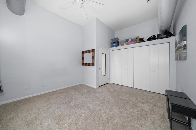 bedroom with lofted ceiling, light colored carpet, and ceiling fan