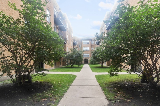 view of home's community featuring a yard