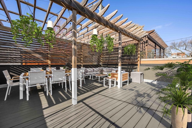 wooden deck featuring an outdoor living space and a pergola