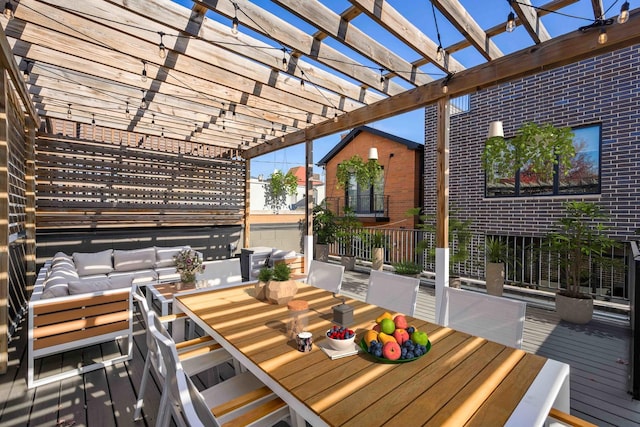 wooden deck with outdoor lounge area and a pergola