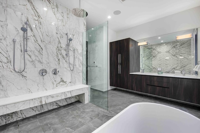 bathroom with vanity and independent shower and bath