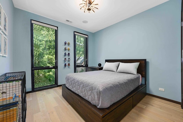 bedroom with light hardwood / wood-style floors