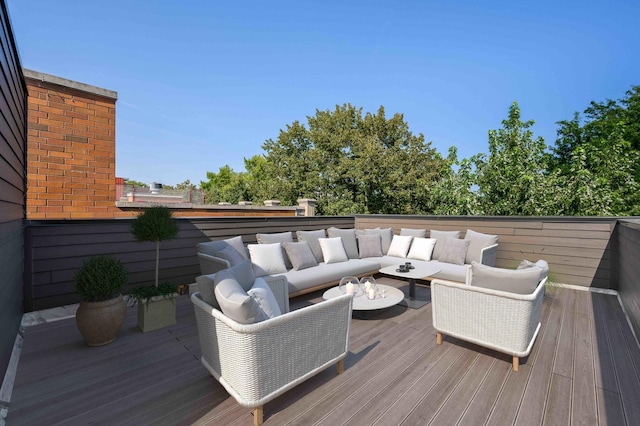 wooden terrace with outdoor lounge area