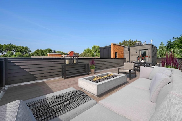 view of patio / terrace with an outdoor living space with a fire pit