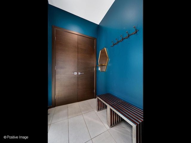 corridor featuring light tile patterned floors