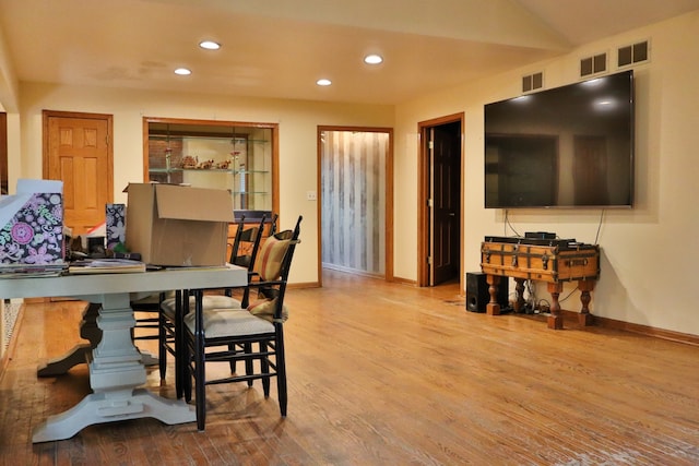 dining area with wood-type flooring