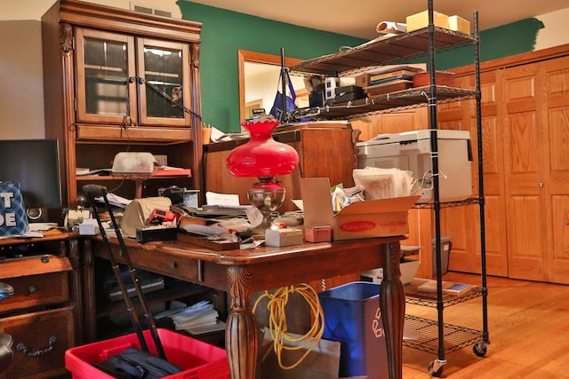 office with light hardwood / wood-style flooring