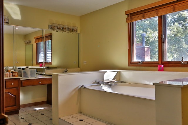 bathroom featuring tile patterned flooring, a bath, and vanity