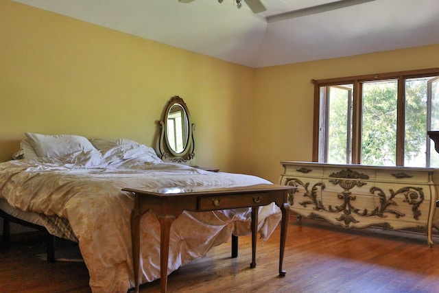 bedroom featuring ceiling fan and dark wood-type flooring