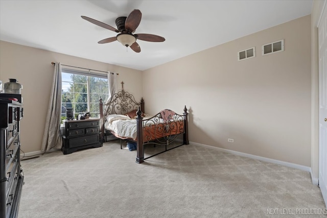 bedroom featuring light colored carpet and ceiling fan