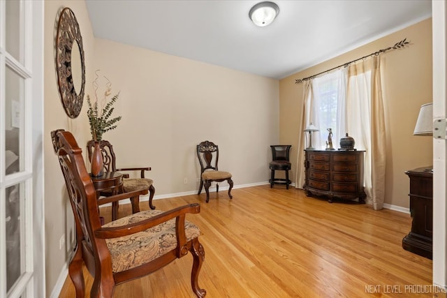 sitting room featuring hardwood / wood-style flooring