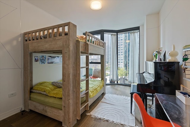 bedroom featuring dark hardwood / wood-style flooring