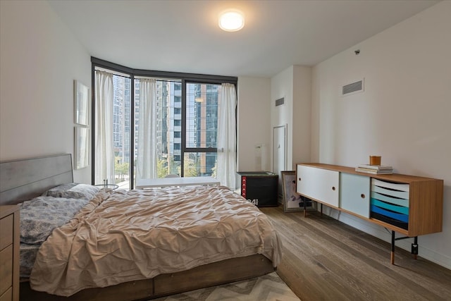 bedroom featuring hardwood / wood-style flooring