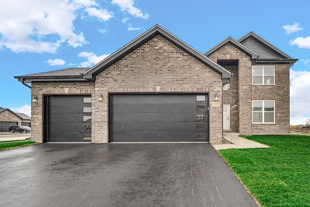 view of front facade featuring a front lawn and a garage