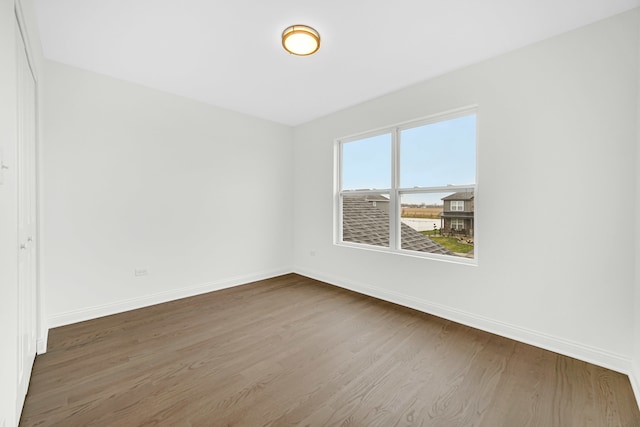 empty room featuring hardwood / wood-style flooring