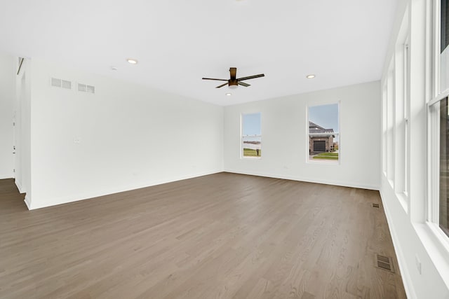 spare room featuring ceiling fan and wood-type flooring