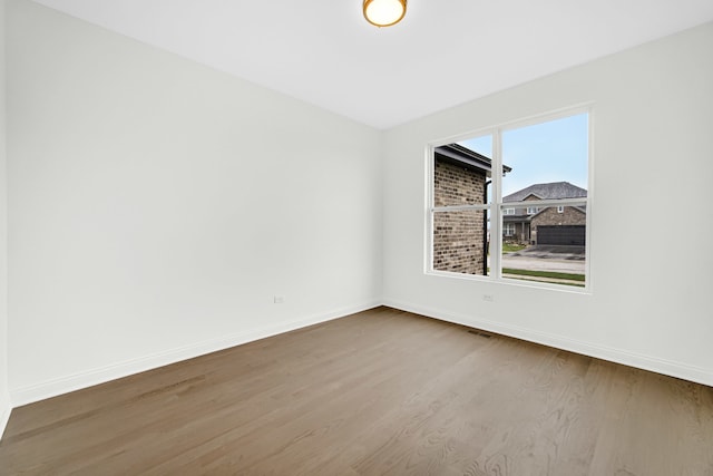 empty room featuring hardwood / wood-style flooring