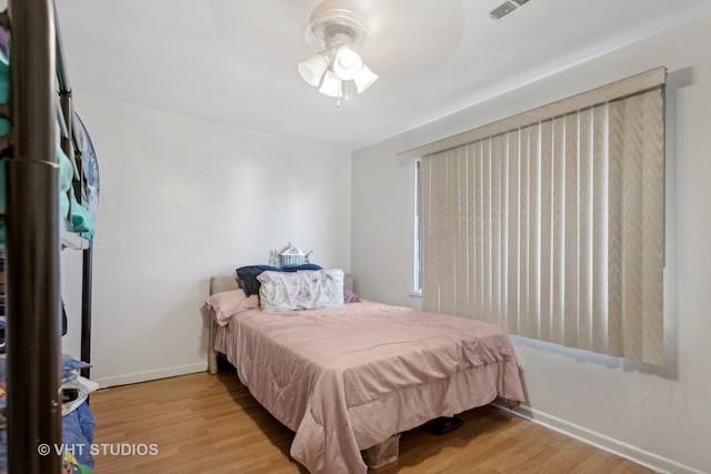 bedroom featuring ceiling fan and light hardwood / wood-style flooring