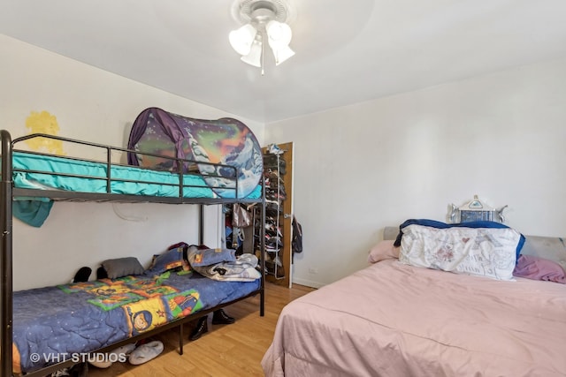 bedroom featuring ceiling fan and hardwood / wood-style flooring