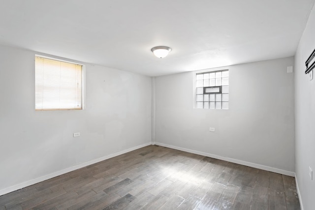 unfurnished room featuring dark wood-type flooring