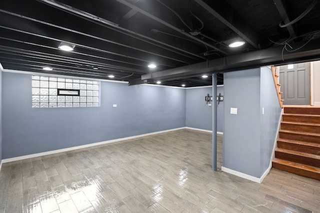 basement featuring hardwood / wood-style floors