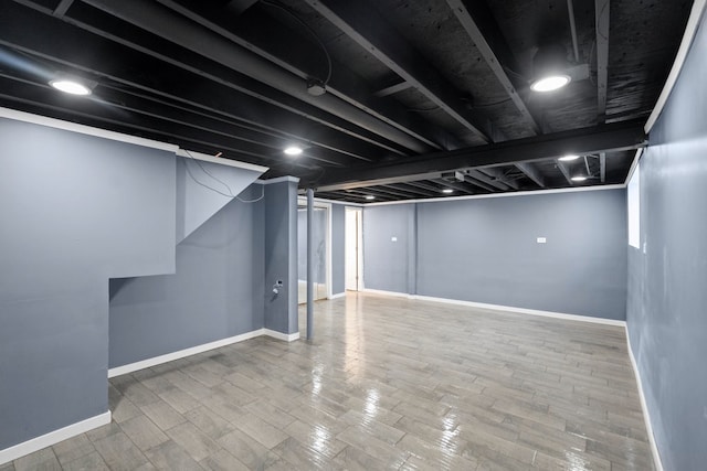 basement with wood-type flooring