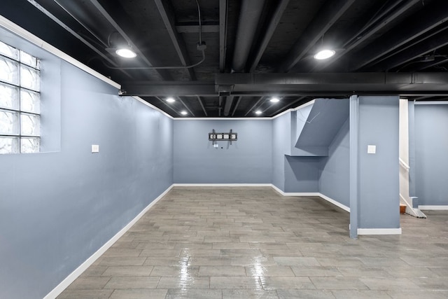 basement featuring hardwood / wood-style flooring