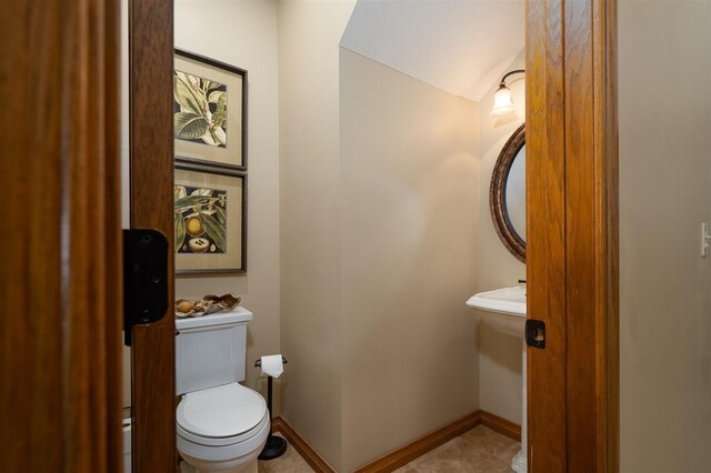 bathroom with tile patterned floors, decorative columns, and vanity