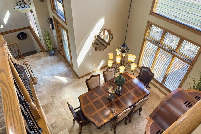 stairway featuring a towering ceiling