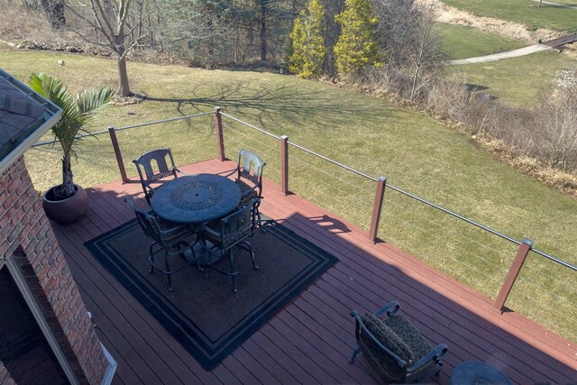 sunroom / solarium featuring beamed ceiling