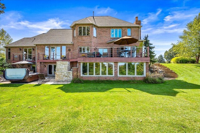 rear view of property featuring a yard and a deck