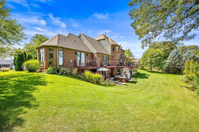 view of patio / terrace featuring a balcony, french doors, exterior bar, a hot tub, and area for grilling