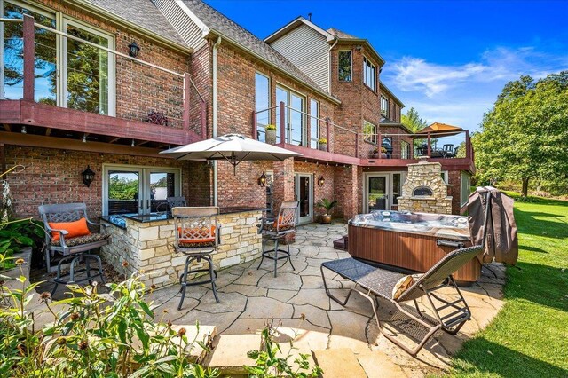 view of patio / terrace featuring a hot tub