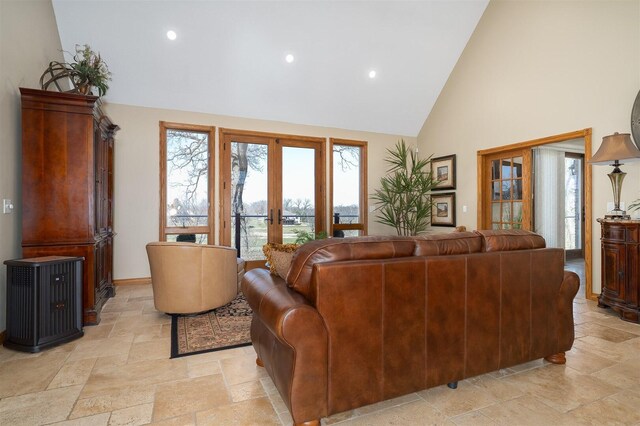 living room with high vaulted ceiling and ceiling fan