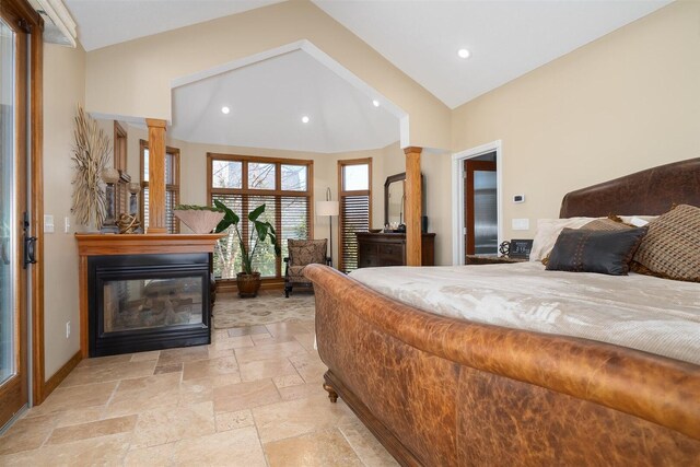 kitchen featuring a fireplace, decorative light fixtures, an island with sink, dark wood-type flooring, and appliances with stainless steel finishes